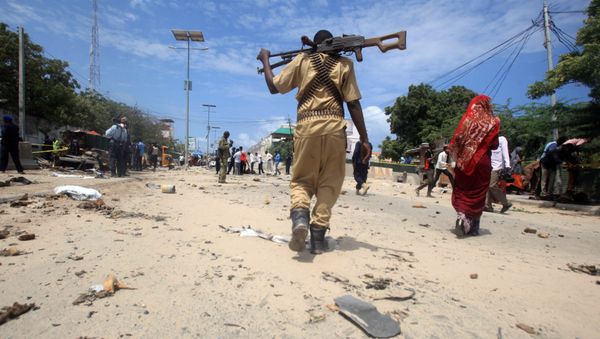 A Somali policeman walks towards the scene of an explosion (File) A Somali policeman walks towards the scene of an explosion (File) - Sputnik International
