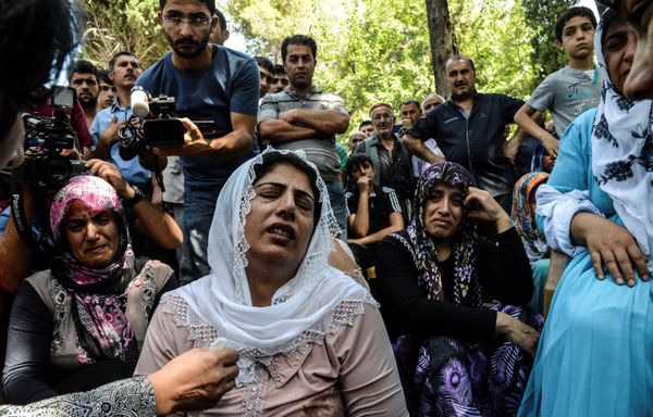 Halima Alparslan is seen among women crying during a funeral for a victim of last night's attack on a wedding party that left 50 dead in Gaziantep in southeastern Turkey near the Syrian border on August 21, 2016 Halima Alparslan is seen among women crying during a funeral for a victim of last night's attack on a wedding party that left 50 dead in Gaziantep in southeastern Turkey near the Syrian border on August 21, 2016 - Sputnik International