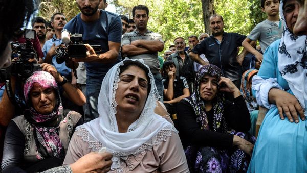 Women cry during a funeral for a victim of last night's attack on a wedding party that left 50 dead in Gaziantep in southeastern Turkey near the Syrian border on August 21, 2016 Women cry during a funeral for a victim of last night's attack on a wedding party that left 50 dead in Gaziantep in southeastern Turkey near the Syrian border on August 21, 2016 - Sputnik International