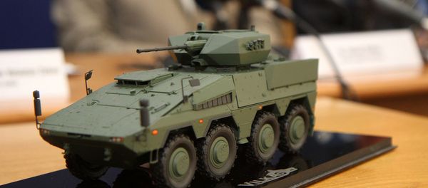 A model of the Boxer infantry fighting vehicles (IFV) is pictured during a press conference at the Ministry of National Defence in Vilnius, Lithuania, on August 22, 2016 A model of the Boxer infantry fighting vehicles (IFV) is pictured during a press conference at the Ministry of National Defence in Vilnius, Lithuania, on August 22, 2016 - Sputnik International