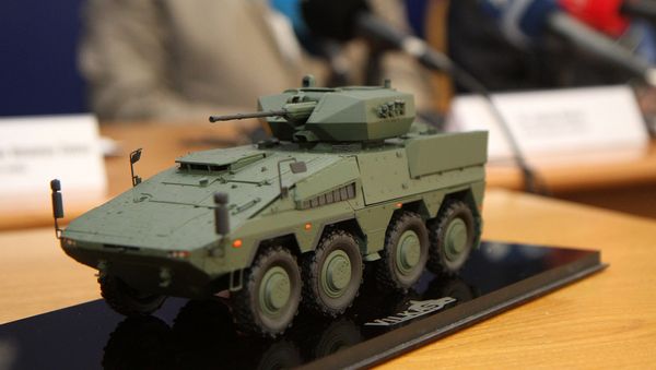 A model of the Boxer infantry fighting vehicles (IFV) is pictured during a press conference at the Ministry of National Defence in Vilnius, Lithuania, on August 22, 2016 A model of the Boxer infantry fighting vehicles (IFV) is pictured during a press conference at the Ministry of National Defence in Vilnius, Lithuania, on August 22, 2016 - Sputnik International