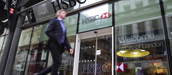 A businessmen walks past the entrance to a HSBC bank branch in London (File) A businessmen walks past the entrance to a HSBC bank branch in London (File) - Sputnik International