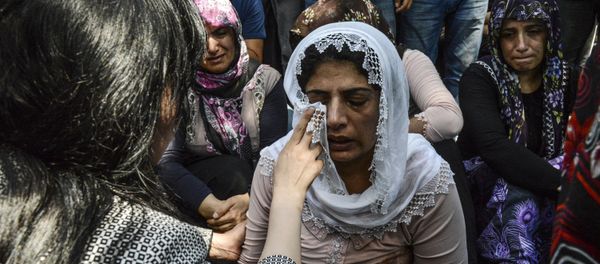 Women cry during a funeral for victims of last night's attack on a wedding party that left 50 dead in Gaziantep in southeastern Turkey near the Syrian border on August 21, 2016 Women cry during a funeral for victims of last night's attack on a wedding party that left 50 dead in Gaziantep in southeastern Turkey near the Syrian border on August 21, 2016 - Sputnik International