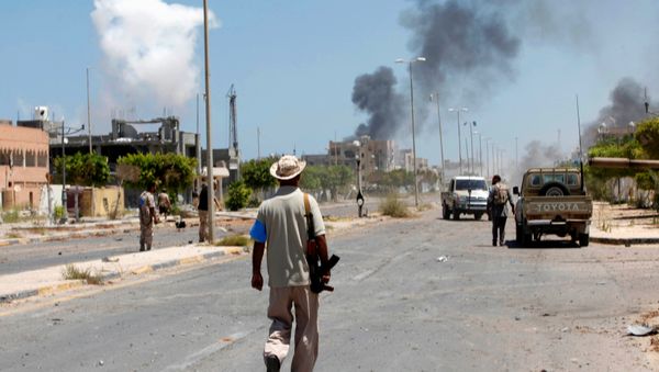 Smoke rises during a battle between Libyan forces allied with the U.N.-backed government and Islamic State fighters in neighborhood Number Two in Sirte, Libya August 16, 2016 Smoke rises during a battle between Libyan forces allied with the U.N.-backed government and Islamic State fighters in neighborhood Number Two in Sirte, Libya August 16, 2016 - Sputnik International