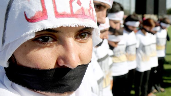 Yazidi women attend a demonstration at a refugee camp in Kurdish-dominated city of Diyarbakir, Turkey, to mark the second anniversary of what a U.N.-appointed commission of independent war crimes investigators termed a genocide against the Yazidi population by the Islamic State, August 3, 2016 - Sputnik International