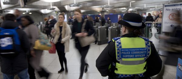 A British Transport Police Community Support officer stands by the barriers at Westminster underground train station in London, Monday, Dec. 7, 2015 - Sputnik International