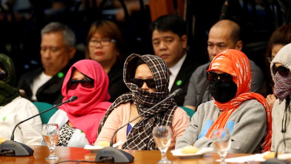 Family members of people alleged by police as drug pushers and were killed during an illegal drugs meth raid, wear masks during a Senate hearing regarding people killed during a crackdown on illegal drugs in Pasay, Metro Manila, Philippines August 23, 2016. Family members of people alleged by police as drug pushers and were killed during an illegal drugs meth raid, wear masks during a Senate hearing regarding people killed during a crackdown on illegal drugs in Pasay, Metro Manila, Philippines August 23, 2016. - Sputnik International