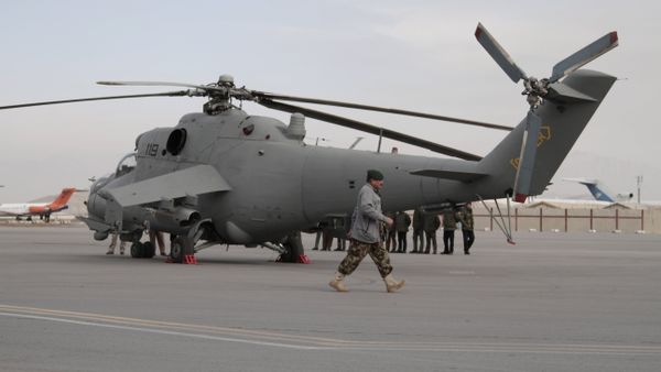 An Afghan soldier walks past Indian donated helicopters to Afghanistan at the Kabul airport in Kabul, Afghanistan, Friday, Dec. 25, 2015 An Afghan soldier walks past Indian donated helicopters to Afghanistan at the Kabul airport in Kabul, Afghanistan, Friday, Dec. 25, 2015 - Sputnik International