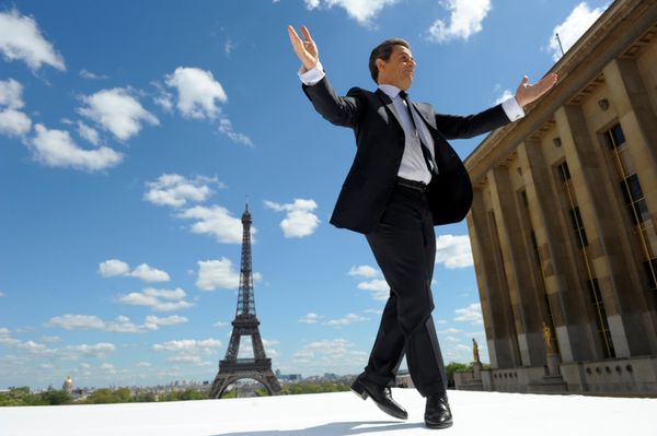 France's President and UMP party candidate for his re-election in the 2012 French presidential elections, Nicolas Sarkozy waves to supporters as he arrives on stage at Trocadero square to deliver a speech during a campaign rally in front the Eiffel Tower in Paris, France May 1, 2012.  - Sputnik International
