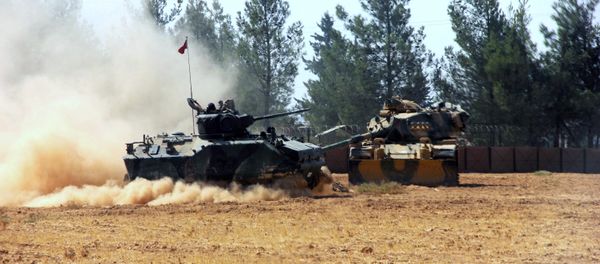 A Turkish army tank and an armored vehicle are stationed near the border with Syria, in Karkamis, Turkey, Tuesday, Aug. 23, 2016 A Turkish army tank and an armored vehicle are stationed near the border with Syria, in Karkamis, Turkey, Tuesday, Aug. 23, 2016 - Sputnik International