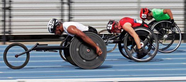 Casey Followay, left, Stephen Binning, center, and Arturo Torres, right, race in their heat in the men's 100-meter dash during the U.S. Paralympics Team Trials in Charlotte, N.C., Friday, July 1, 2016. - Sputnik International