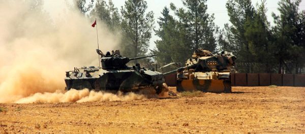A Turkish army tank and an armoured vehicle are stationed near the Turkish-Syrian border in Karkamis in the southeastern Gaziantep province, Turkey, August 23, 2016. A Turkish army tank and an armoured vehicle are stationed near the Turkish-Syrian border in Karkamis in the southeastern Gaziantep province, Turkey, August 23, 2016. - Sputnik International