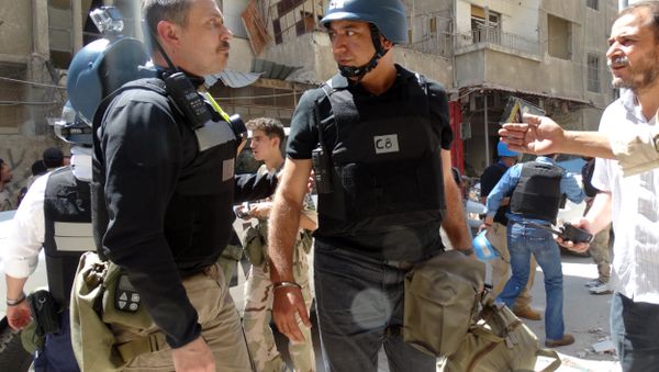 United Nations (UN) arms experts arrive to inspect a site suspected of being hit by a deadly chemical weapons attack last week in the Eastern Ghouta area on the northeastern outskirts of Damascus. (File United Nations (UN) arms experts arrive to inspect a site suspected of being hit by a deadly chemical weapons attack last week in the Eastern Ghouta area on the northeastern outskirts of Damascus. (File - Sputnik International