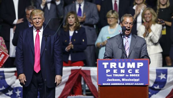 Nigel Farage, ex-leader of the British UKIP party, speaks as Republican presidential candidate Donald Trump, left, listens, at Trump's campaign rally in Jackson, Miss., Wednesday, Aug. 24, 2016. Nigel Farage, ex-leader of the British UKIP party, speaks as Republican presidential candidate Donald Trump, left, listens, at Trump's campaign rally in Jackson, Miss., Wednesday, Aug. 24, 2016. - Sputnik International