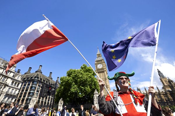 A woman holds up a Polish and European flags in Parliament Square as thousands of protesters take part in a March for Europe, through the centre of London on July 2, 2016, to protest against Britain's vote to leave the EU. A woman holds up a Polish and European flags in Parliament Square as thousands of protesters take part in a March for Europe, through the centre of London on July 2, 2016, to protest against Britain's vote to leave the EU. - Sputnik International
