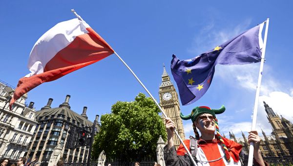 A woman holds up a Polish and European flags in Parliament Square as thousands of protesters take part in a March for Europe, through the centre of London on July 2, 2016, to protest against Britain's vote to leave the EU. A woman holds up a Polish and European flags in Parliament Square as thousands of protesters take part in a March for Europe, through the centre of London on July 2, 2016, to protest against Britain's vote to leave the EU. - Sputnik International
