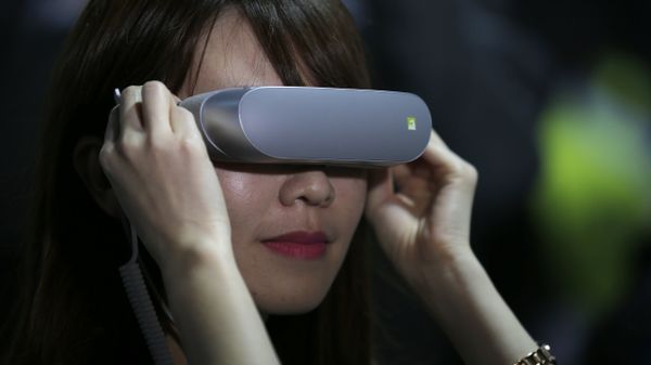 In this Feb. 21. 2016, file photo, a woman uses LG 360 VR glasses during the LG unpacked 2016 event on the eve of the week's Mobile World Congress wireless show, in Barcelona, Spain - Sputnik International
