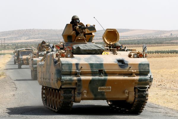 Turkish armoured personnel carriers escort military vehicles on a main road in Karkamis on the Turkish-Syrian border in the southeastern Gaziantep province, Turkey, August 26, 2016 Turkish armoured personnel carriers escort military vehicles on a main road in Karkamis on the Turkish-Syrian border in the southeastern Gaziantep province, Turkey, August 26, 2016 - Sputnik International