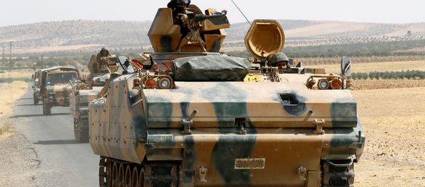 Turkish armoured personnel carriers escort military vehicles on a main road in Karkamis on the Turkish-Syrian border in the southeastern Gaziantep province, Turkey, August 26, 2016 Turkish armoured personnel carriers escort military vehicles on a main road in Karkamis on the Turkish-Syrian border in the southeastern Gaziantep province, Turkey, August 26, 2016 - Sputnik International