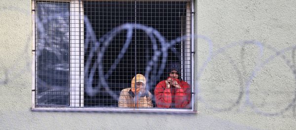 Migrants watch out of a window behind a fence at the Bela-Jezova detention centre for refugees near Bela pod Bezdezem, northeast of Prague (File) Migrants watch out of a window behind a fence at the Bela-Jezova detention centre for refugees near Bela pod Bezdezem, northeast of Prague (File) - Sputnik International