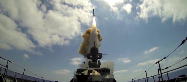 A Russian Navy ship launches a Kalibr cruise missile at the Jabhat Al-Nusra terrorist groupfrom the Mediterranean Sea. File photo - Sputnik International