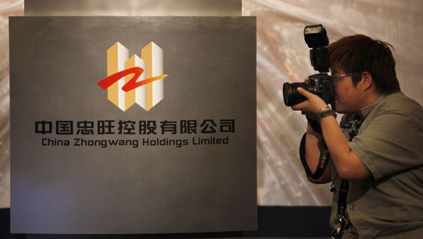 A photographer takes a picture of the logo of China Zhongwang Holdings Limited displayed at a news conference in Hong Kong (File) A photographer takes a picture of the logo of China Zhongwang Holdings Limited displayed at a news conference in Hong Kong (File) - Sputnik International