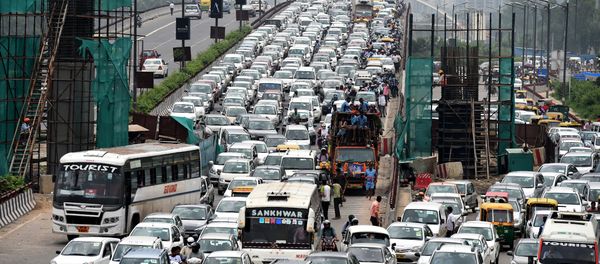 Indian commuters and their vehicles stand in a traffic jam in New Delhi (File) Indian commuters and their vehicles stand in a traffic jam in New Delhi (File) - Sputnik International