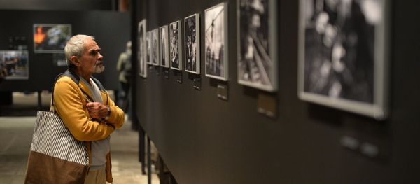 A visitor at the opening of a photo exhibition of the prizewinners in the Andrei Stenin International Press Photo Contest in Moscow. File photo - Sputnik International