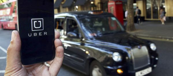 A photo illustration shows the Uber app logo displayed on a mobile telephone, as it is held up for a posed photograph in central London, Britain August 17, 2016. A photo illustration shows the Uber app logo displayed on a mobile telephone, as it is held up for a posed photograph in central London, Britain August 17, 2016. - Sputnik International