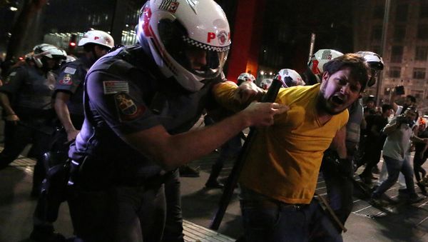 A man is detained by riot police during a protest by supporters of Brazil's suspended President Dilma Rousseff at Paulista avenue in Sao Paulo, Brazil, August 29, 2016 A man is detained by riot police during a protest by supporters of Brazil's suspended President Dilma Rousseff at Paulista avenue in Sao Paulo, Brazil, August 29, 2016 - Sputnik International