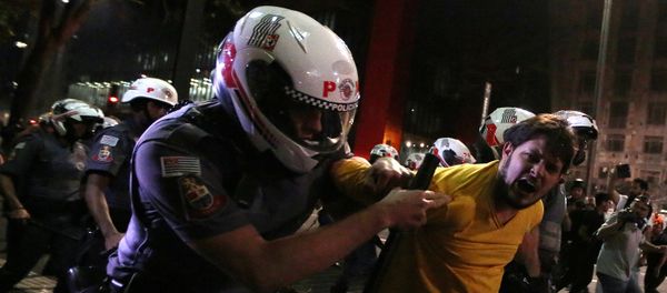 A man is detained by riot police during a protest by supporters of Brazil's suspended President Dilma Rousseff at Paulista avenue in Sao Paulo, Brazil, August 29, 2016 A man is detained by riot police during a protest by supporters of Brazil's suspended President Dilma Rousseff at Paulista avenue in Sao Paulo, Brazil, August 29, 2016 - Sputnik International