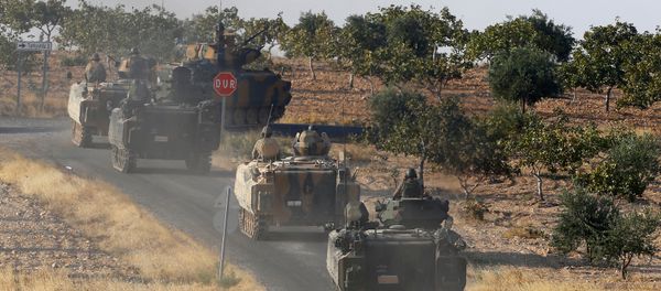 Turkish armoured personnel carriers drive towards the border in Karkamis on the Turkish-Syrian border in the southeastern Gaziantep province, Turkey, August 27, 2016 - Sputnik International