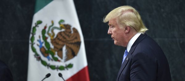 US presidential candidate Donald Trump leaves after a joint press conference with Mexican President Enrique Pena Nieto (out of frame) in Mexico City on August 31, 2016. - Sputnik International