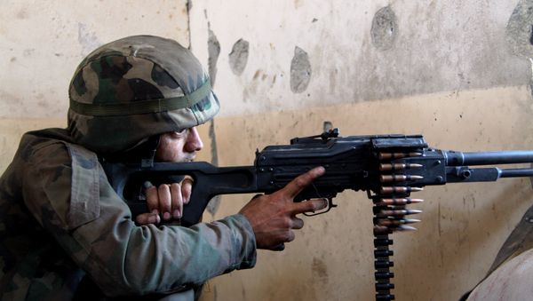 A Syrian army fighter in position during the assault of the BBC school in the southern part of the Syrian city of Aleppo A Syrian army fighter in position during the assault of the BBC school in the southern part of the Syrian city of Aleppo - Sputnik International