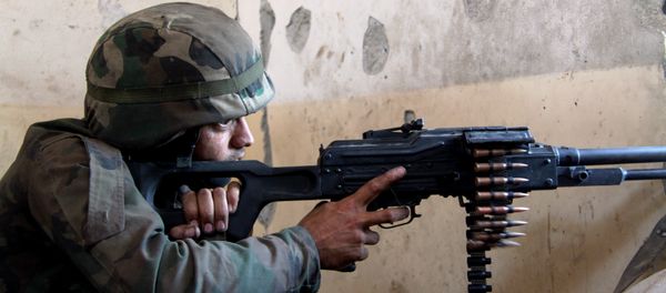 A Syrian army fighter in position during the assault of the BBC school in the southern part of the Syrian city of Aleppo A Syrian army fighter in position during the assault of the BBC school in the southern part of the Syrian city of Aleppo - Sputnik International