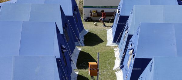 A child plays at a tent camp set as a temporary shelter for the earthquake survivors in Arquata Del Tronto, Italy A child plays at a tent camp set as a temporary shelter for the earthquake survivors in Arquata Del Tronto, Italy - Sputnik International