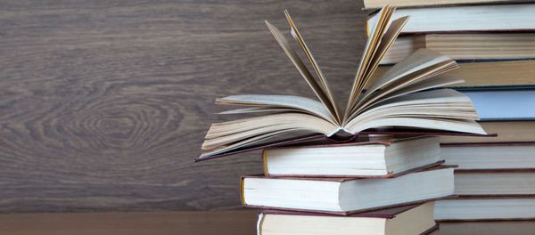 Books on wooden deck tabletop. Books on wooden deck tabletop. - Sputnik International
