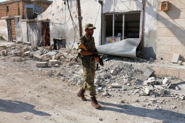 A member of Turkish-backed Free Syrian Army (FSA) patrols in the border town of Jarablus, Syria A member of Turkish-backed Free Syrian Army (FSA) patrols in the border town of Jarablus, Syria - Sputnik International