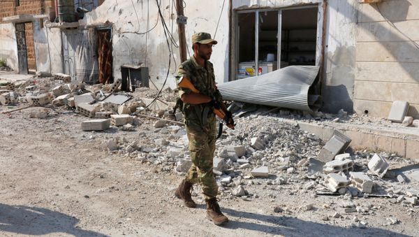 A member of Turkish-backed Free Syrian Army (FSA) patrols in the border town of Jarablus, Syria A member of Turkish-backed Free Syrian Army (FSA) patrols in the border town of Jarablus, Syria - Sputnik International