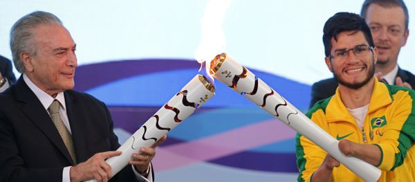 Brazil's acting President Michel Temer, left, lights the torch of Paralympic athlete Yohansson Nascimento during a ceremony for 2016 Rio Paralympic Games at the Planalto Presidential Palace, in Brasilia, Brazil, Thursday, Aug. 25, 2016. Brazil's acting President Michel Temer, left, lights the torch of Paralympic athlete Yohansson Nascimento during a ceremony for 2016 Rio Paralympic Games at the Planalto Presidential Palace, in Brasilia, Brazil, Thursday, Aug. 25, 2016. - Sputnik International