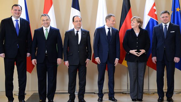 French President Francois Hollande, Polish Prime Minister Donald Tusk, German Chancellor Angela Merkel and Slovak Prime Minister Robert Fico pose for a picture prior a meeting with Visegrad Group (Poland, the Czech Republic, Hungary and Slovakia) on March 6, 2013 in Warsaw. French President Francois Hollande, Polish Prime Minister Donald Tusk, German Chancellor Angela Merkel and Slovak Prime Minister Robert Fico pose for a picture prior a meeting with Visegrad Group (Poland, the Czech Republic, Hungary and Slovakia) on March 6, 2013 in Warsaw. - Sputnik International