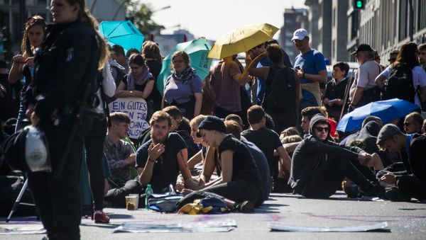 Activists from the Blockupy movement stage a sit down in front of the ministry for works and pension in Berlin Activists from the Blockupy movement stage a sit down in front of the ministry for works and pension in Berlin - Sputnik International
