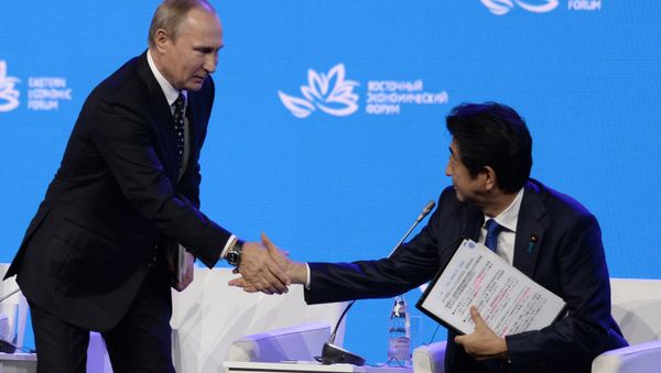 Russian President Vladimir Putin (left) and Japanese Prime Minister Shinzo Abe at the plenary session Discovering the Far East within the framework of the Eastern Economic Forum. Russian President Vladimir Putin (left) and Japanese Prime Minister Shinzo Abe at the plenary session Discovering the Far East within the framework of the Eastern Economic Forum. - Sputnik International
