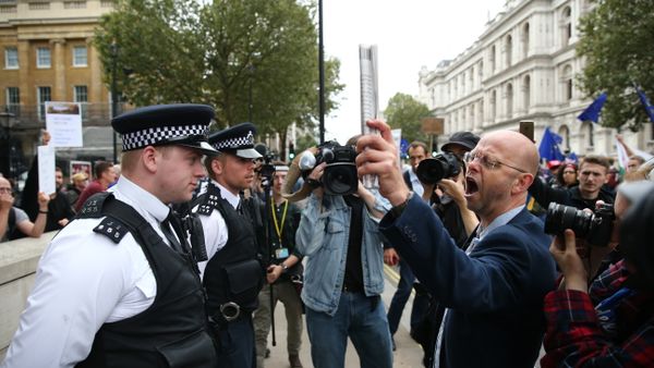Police stand in a cordon as a pro-Europe (R) marcher on a March for Europe demonstration against the Brexit vote in Parliament Square in central London - Sputnik International