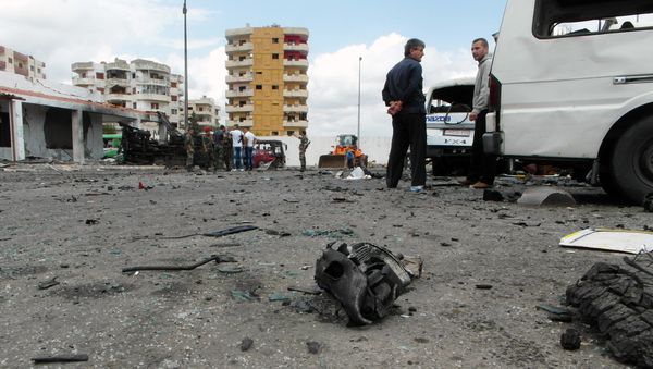 Syrians gather at the scene of multiple bombings in the the city of Tartus northwest of Damascus. File photo Syrians gather at the scene of multiple bombings in the the city of Tartus northwest of Damascus. File photo - Sputnik International