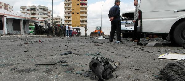 Syrians gather at the scene of multiple bombings in the the city of Tartus northwest of Damascus. File photo Syrians gather at the scene of multiple bombings in the the city of Tartus northwest of Damascus. File photo - Sputnik International