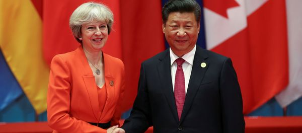 Chinese President Xi Jinping (R) shakes hands with Britain's Prime Minister Theresa May during the G20 Summit in Hangzhou, Zhejiang province, China September 4, 2016. - Sputnik International