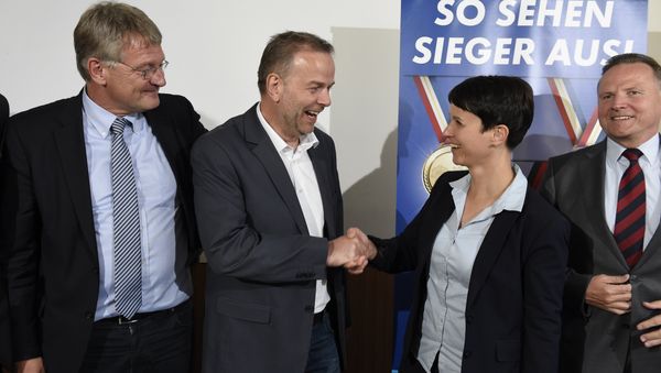 Top candidate for the AFD in Mecklenburg-Western Vorpommern Leif-Erik Holm (2L) shakes hands with AFD leader Frauke Petry flanked by AFD co-leader Joerg Meuthen (L) and AFD's federal whip Georg Pazderski upon arrival for a press conference in Berlin, on September 5, 2016 on day after the regional state elections in Mecklenburg-Western Vorpommern Top candidate for the AFD in Mecklenburg-Western Vorpommern Leif-Erik Holm (2L) shakes hands with AFD leader Frauke Petry flanked by AFD co-leader Joerg Meuthen (L) and AFD's federal whip Georg Pazderski upon arrival for a press conference in Berlin, on September 5, 2016 on day after the regional state elections in Mecklenburg-Western Vorpommern - Sputnik International