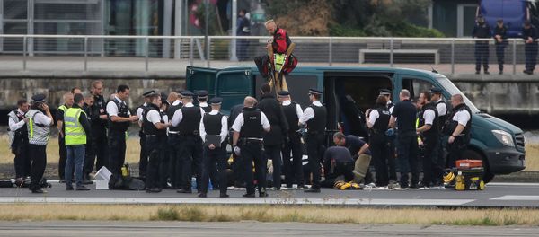 Emergency services surround protestors from the movement Black Lives Matter after they locked themselves to a tripod on the runway at London City Airport in London on September 6, 2016 - Sputnik International