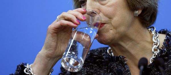 British Prime Minister Theresa May drinks while addressing reporters after the closing of G20 Summit in Hangzhou, Zhejiang Province, China, September 5, 2016. British Prime Minister Theresa May drinks while addressing reporters after the closing of G20 Summit in Hangzhou, Zhejiang Province, China, September 5, 2016. - Sputnik International